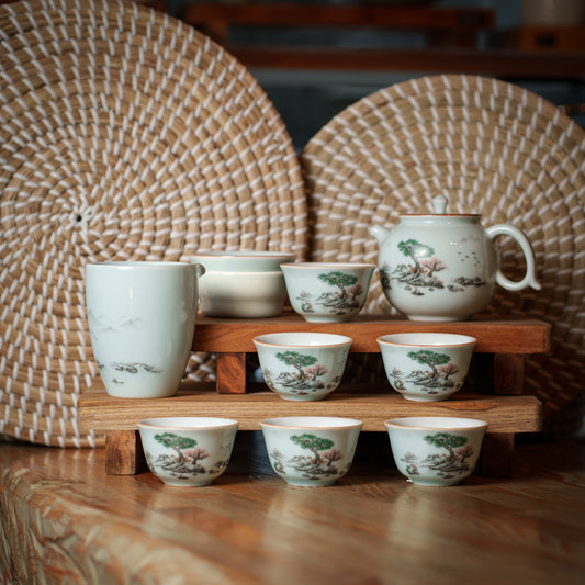 Elegant Porcelain Tea Set with Hand-Painted Landscape Design